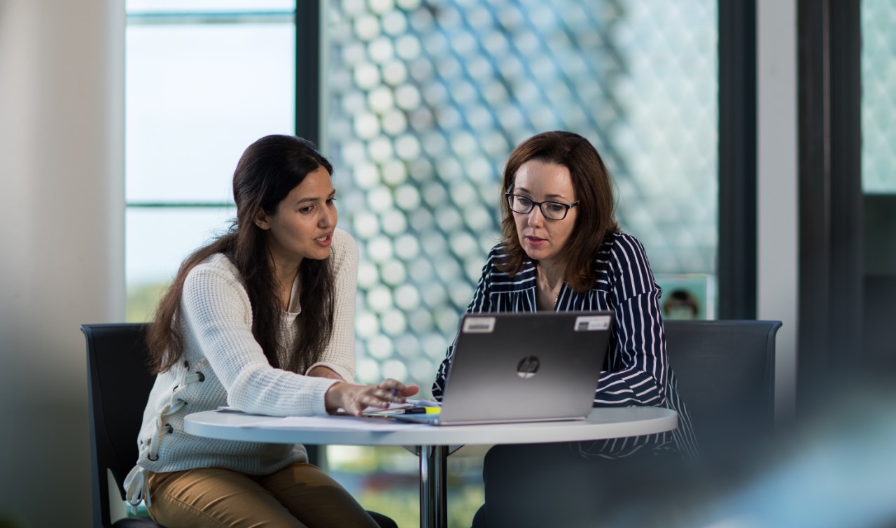 HDR Public Health student with supervisor, in AHMS building